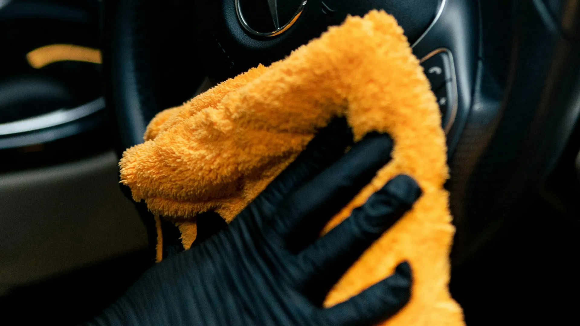 Car interior being cleaned with a microfibre cloth Porter's Car Detailing Loughborough
